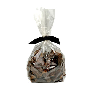 12 oz clear cellophane bag of Wet Nose exclusive, Misfit Duck Sticks dog treats, tied with black ribbon. 2" sized reddish/brown sticks. 