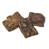 Closeup photo of a small pile of Wet Nose Moo Munch dog treats. Product is varying sizes of square shaped, brown treats, ranging from approximately 2" - 4" wide.