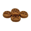 Closeup of five Wet Nose Peanut Butter Paw Print treats. They are brown, round, about 2" wide, and embossed with a paw print shape.