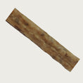 Load image into Gallery viewer, Close-up photo of a piece of a porkie joy stick to show texture.
