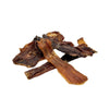 Closeup photo of a small pile of Wet Nose Road Runner Stix dog treats. Product is varying sizes of rectangular shaped, thin brown strips, ranging from approximately 3" - 6" long.
