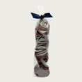 Load image into Gallery viewer, Clear cellophane bag of 15 count Wet Nose exclusive Sliders dog treats, tied with black ribbon. Product inside is round, brown discs.
