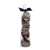 Clear cellophane bag of 15 count Wet Nose exclusive Sliders dog treats, tied with black ribbon. Product inside is round, brown discs.