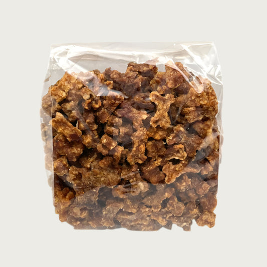 6 oz clear cellophane bag of Wet Nose exclusive Teeny Meaties rabbit treats for dogs. Product inside is very small, brown, bone-shaped treats.